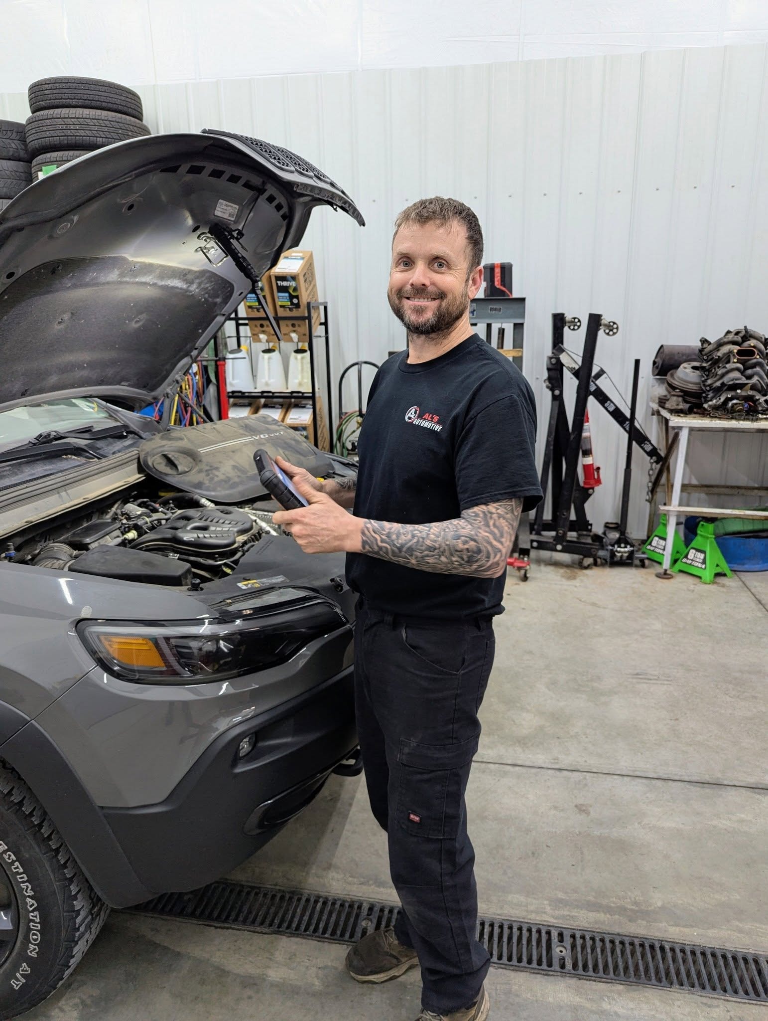 AL’S AUTOMOTIVE technician working on a vehicle